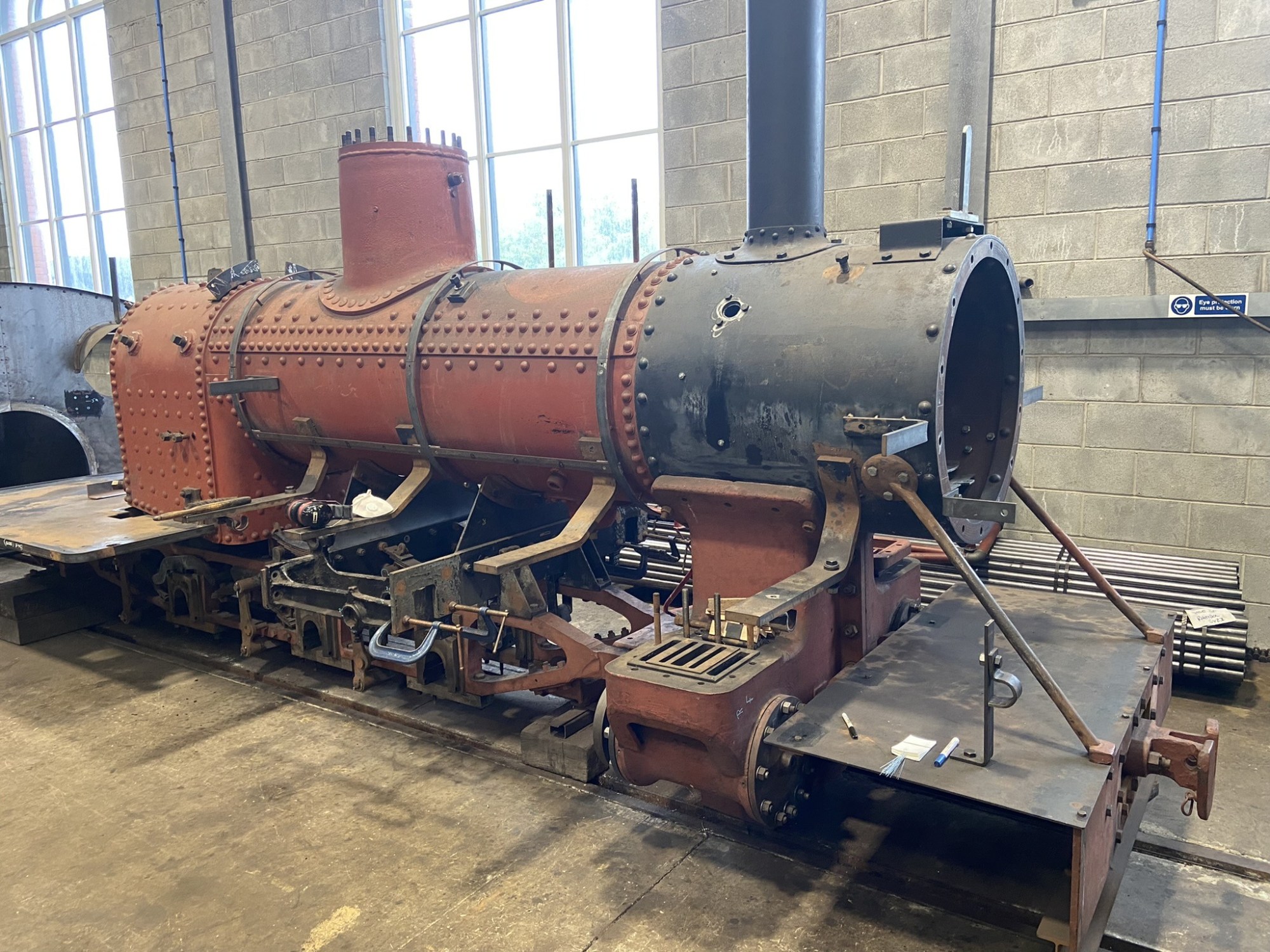 a train is parked on the side of a building