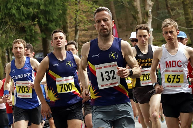 a group of football players posing for a picture