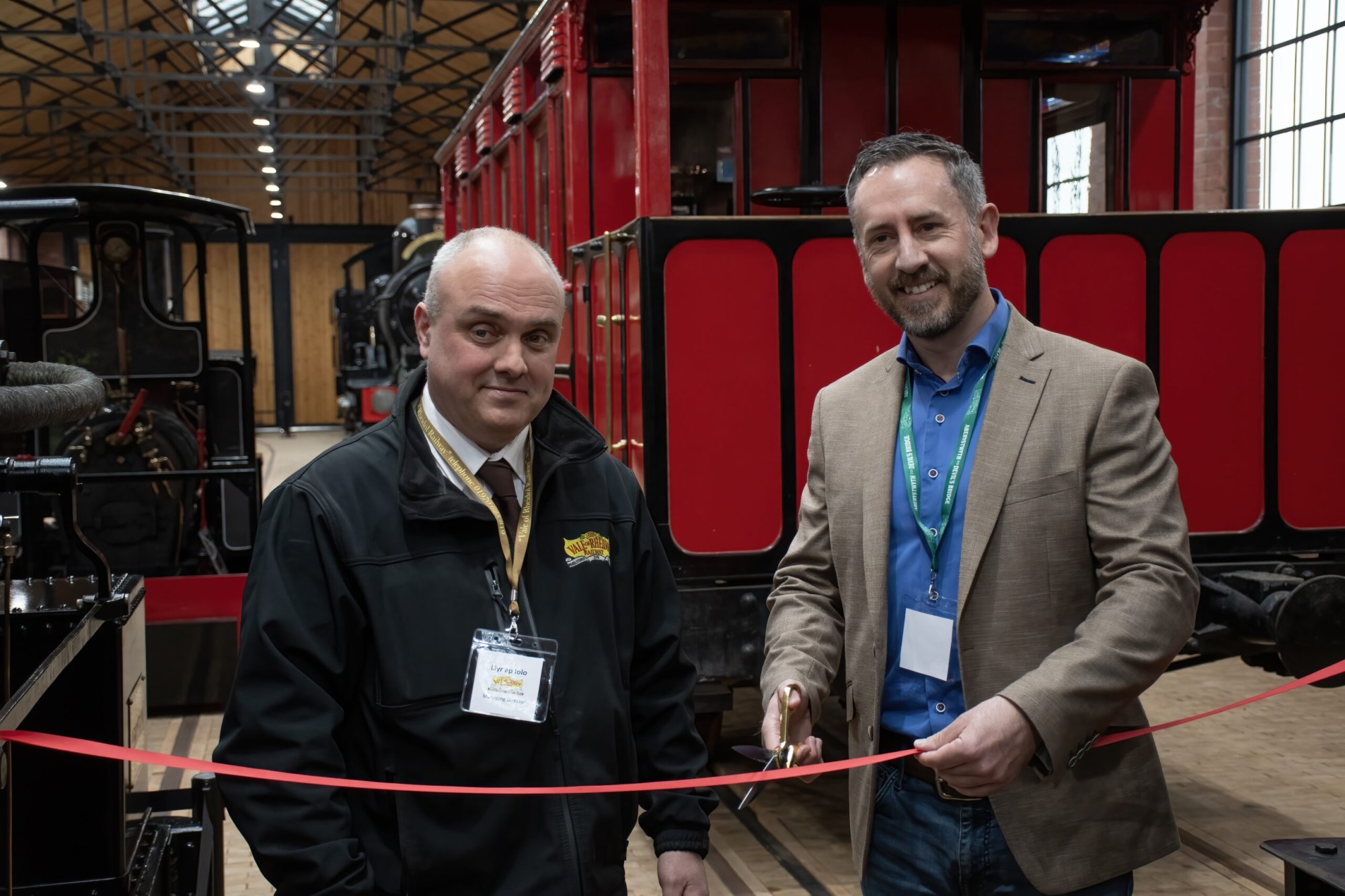Photo 1 – Chris Parry a man standing next to a train