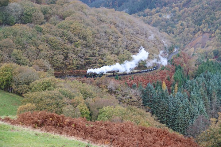 a train is coming down the mountain