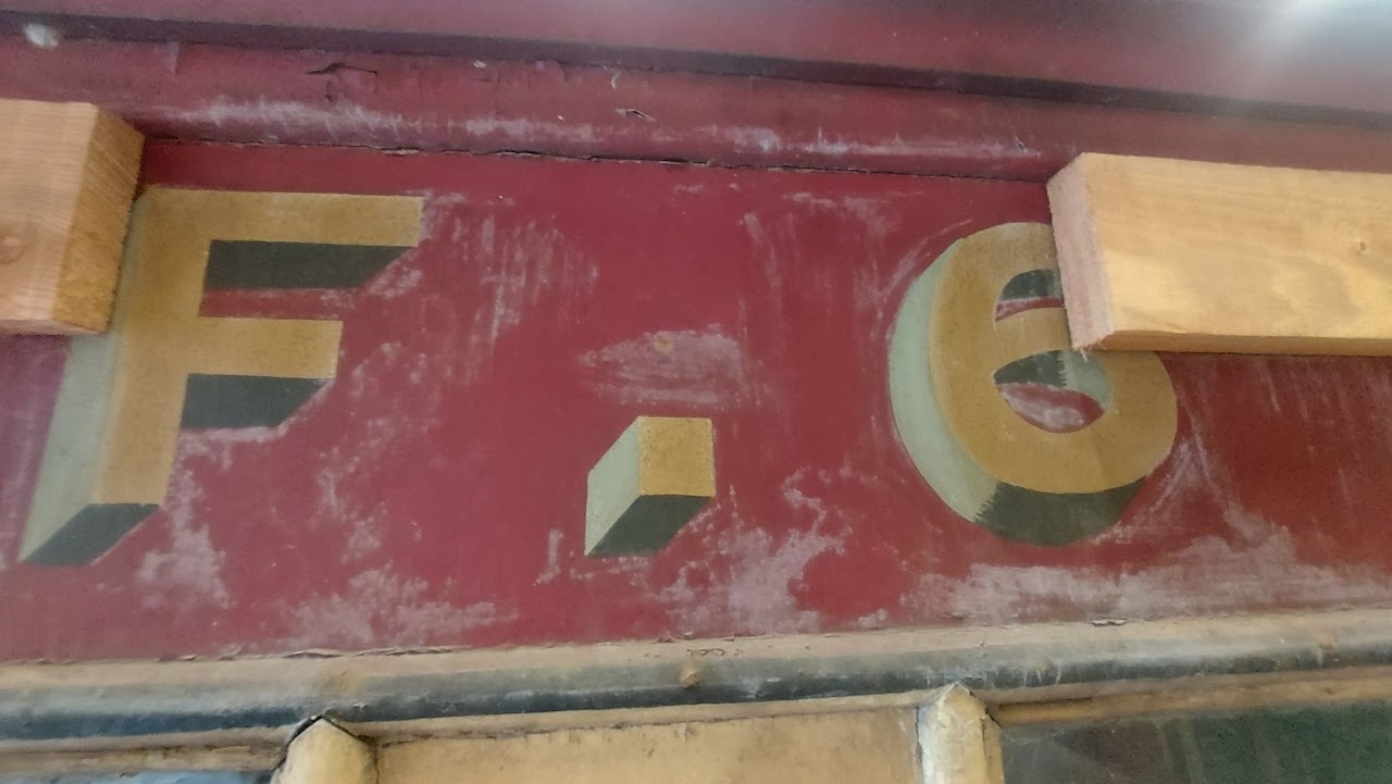 a sign on a wooden surface