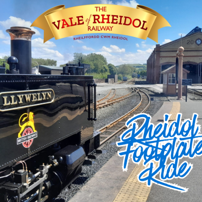 Steam train 'Llywelyn' at a station with 'Vale of Rheidol Railway' sign above.