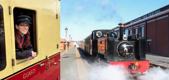 Smiling train conductor in window with vintage steam train at platform on a sunny day.