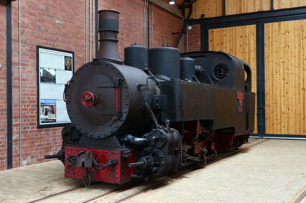 Vintage steam locomotive displayed in a museum.